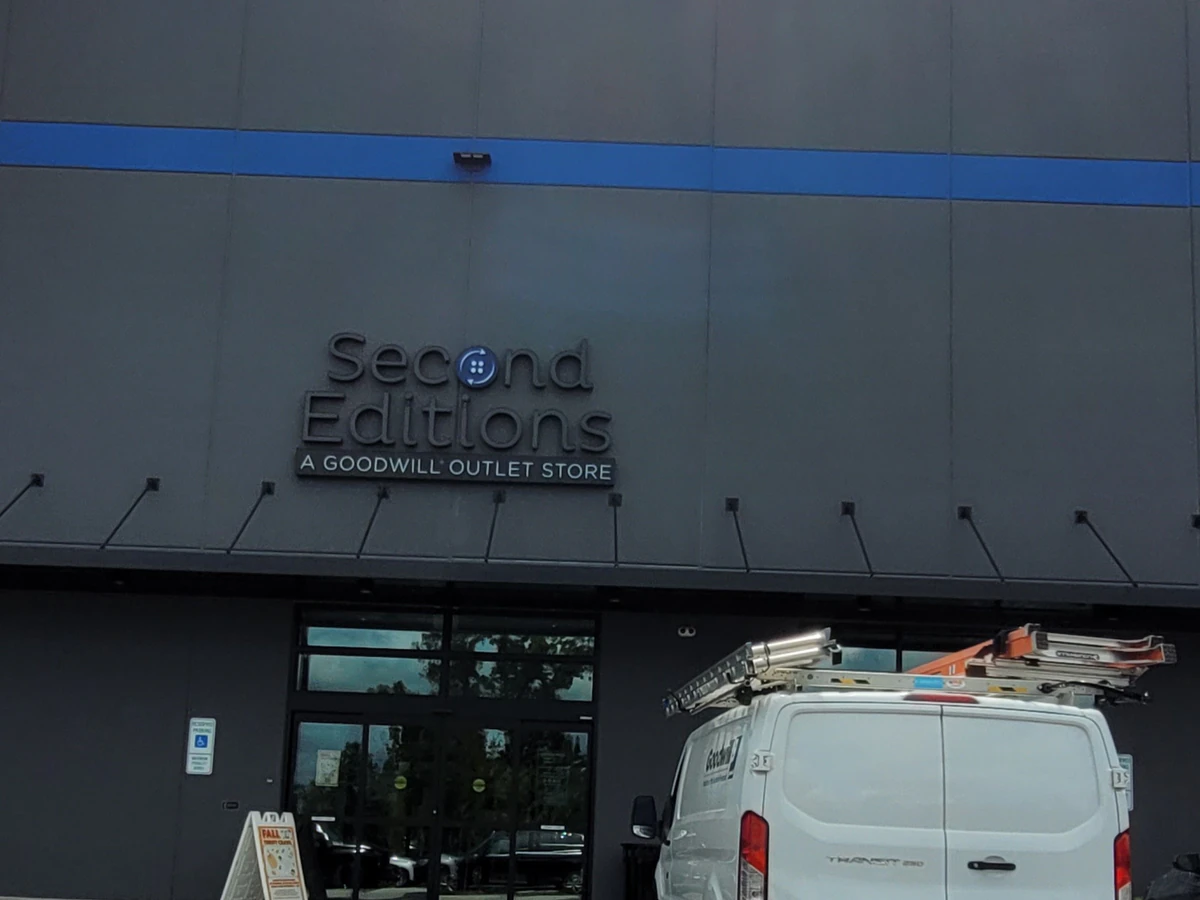 Second Editions - Rock Hill (Goodwill Outlet), a Goodwill outlet store showing blue rolling bins filled with discounted merc.