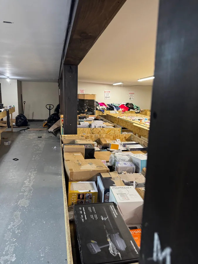 Inside Mad Binz Innisfil bin store in Lefroy, ON showing liquidation bins and bargain finds.