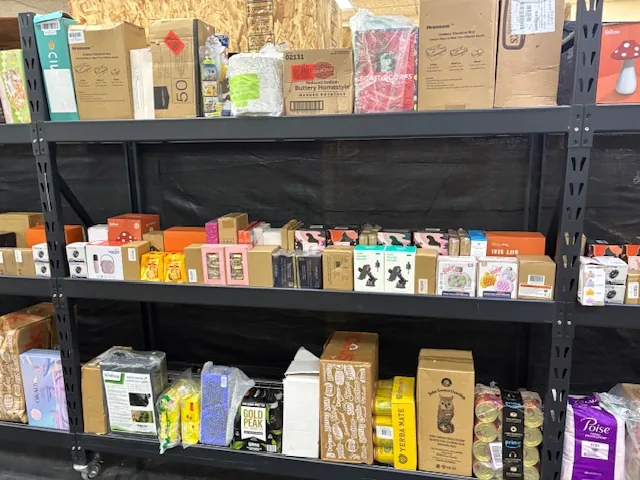 Inside Wizard Bins & Auctions bin store in Redding, CA showing liquidation bins and bargain finds.