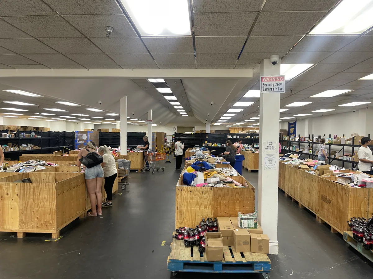 Inside Wizard Bins & Auctions bin store in Redding, CA showing liquidation bins and bargain finds.