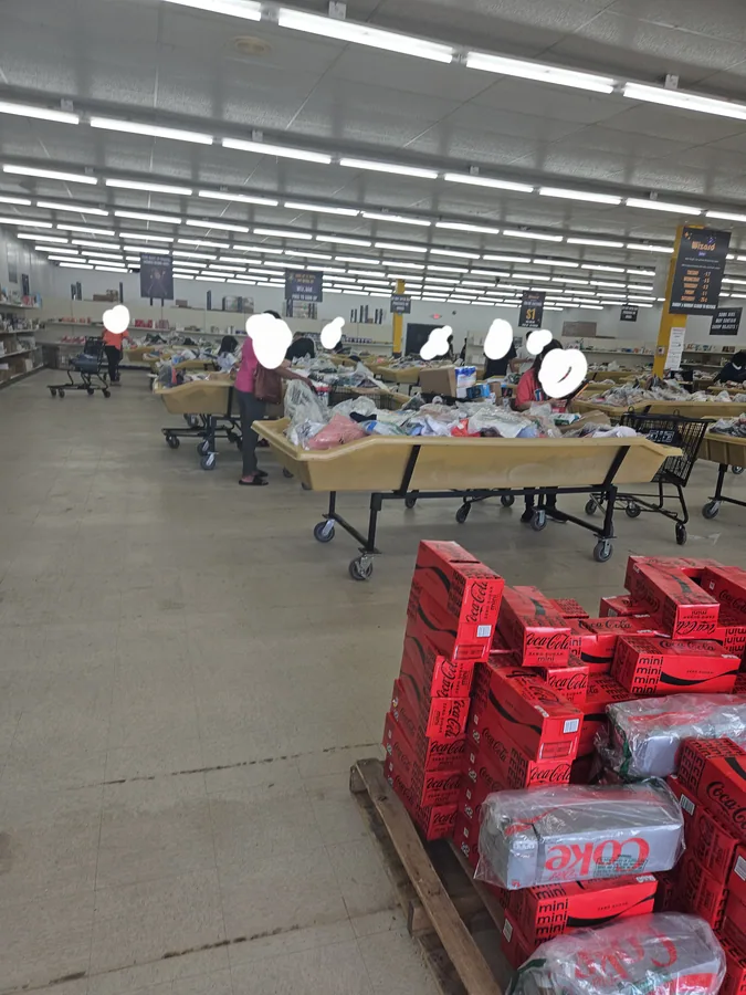 Inside Wizard Bins & Auctions bin store in Virginia Beach, VA showing liquidation bins and bargain finds.